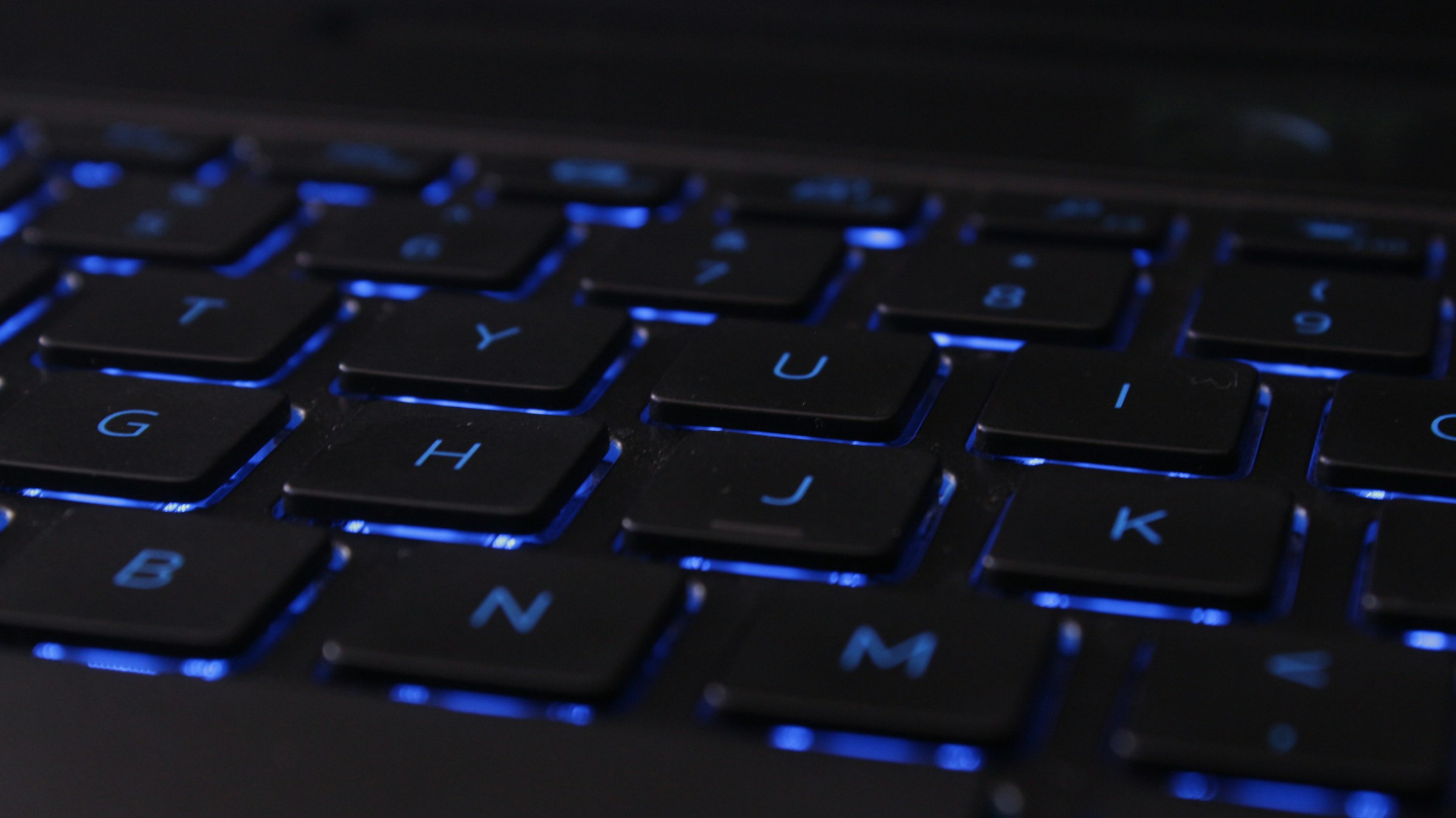 laptop keyboard with blue blacklit keys